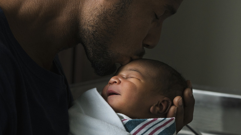 Father kissing his baby