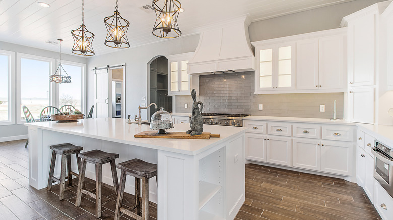 A modern white kitchen with an island 