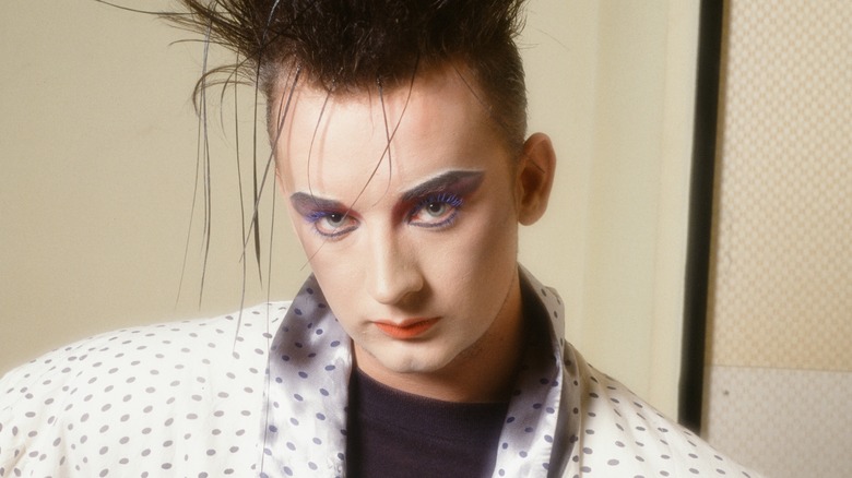 Boy George posing in blue mascara