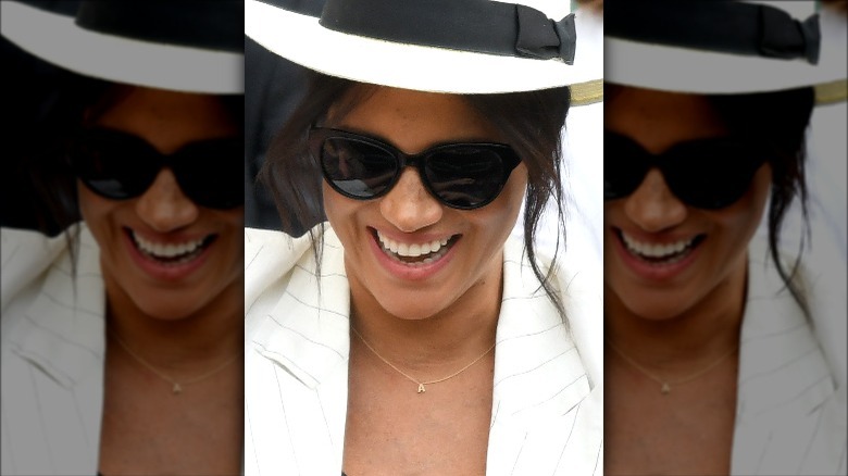 Meghan Markle wearing "A" initial necklace