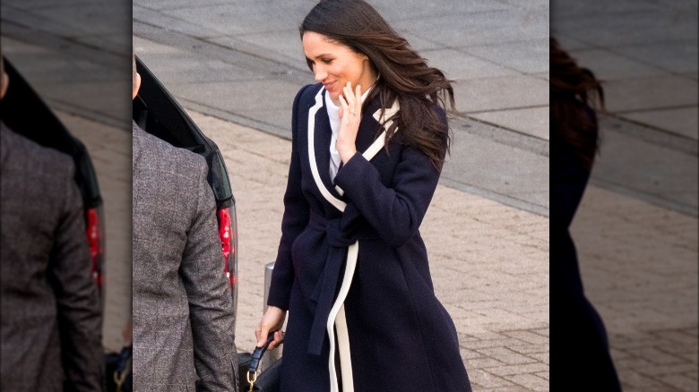 Meghan Markle wearing a long coat