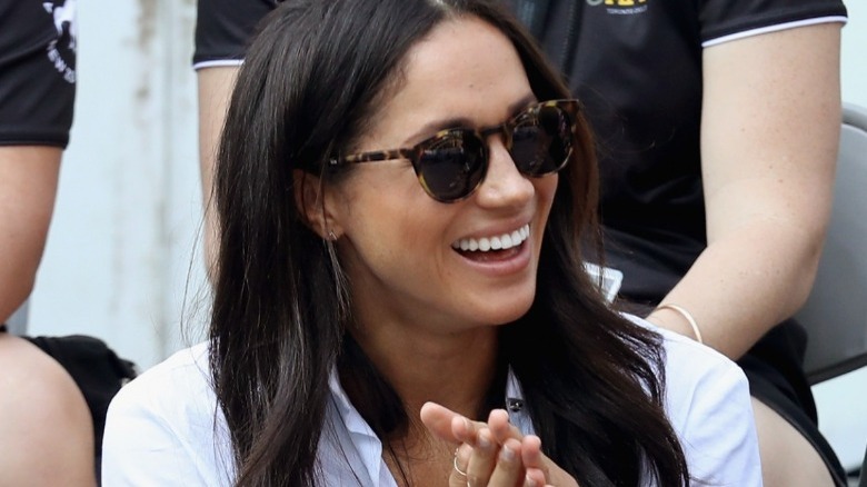 Meghan Markle wearing iconic tortoiseshell glasses at Invictus Games