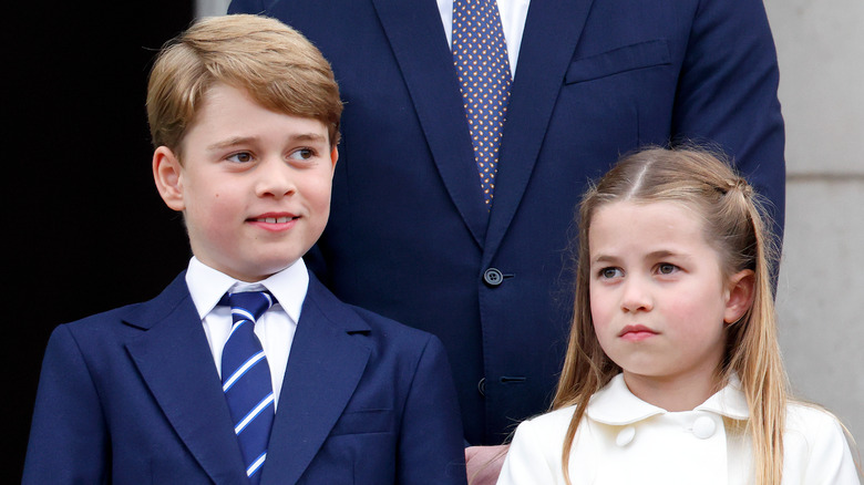 Prince George with Princess Charlotte on balcony