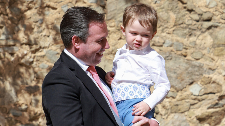 Prince Charles of Luxembourg being held by his father