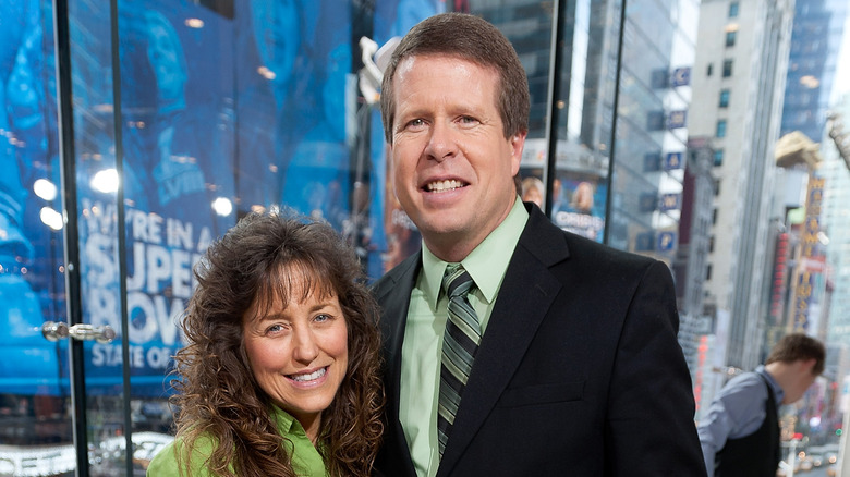 Michelle and Jim Bob Duggar pose together at an event