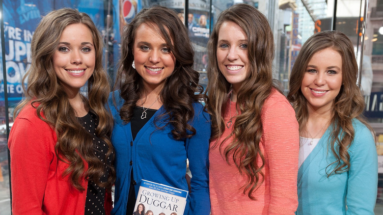 The Duggar sisters pose together at an event