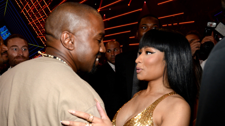 Kanye West and Nicki Minaj speak at an event