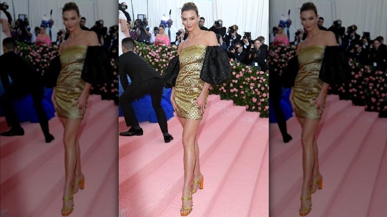 Karlie Kloss smiling and posing for a photo at the Met Gala