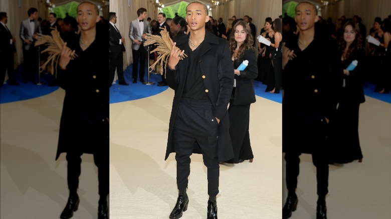 Jaden Smith posing while holding up locks 