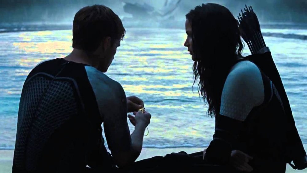 Katniss and Peeta about to kiss in Catching Fire