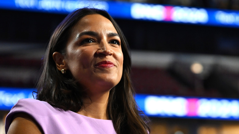 Alexandria Ocasio-Cortez smiling at an event