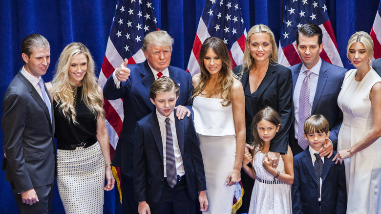 The Trump family poses for a photo, thumbs up from Donald Trump