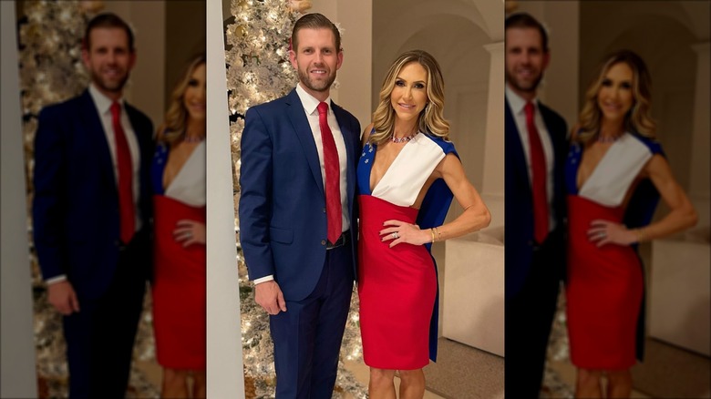 Lara and Eric Trump pose in front of a Christmas tree