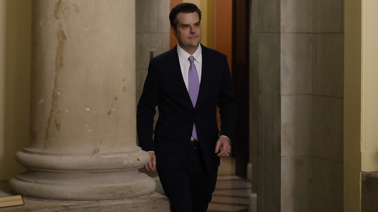 Matt Gaetz walking through a government building