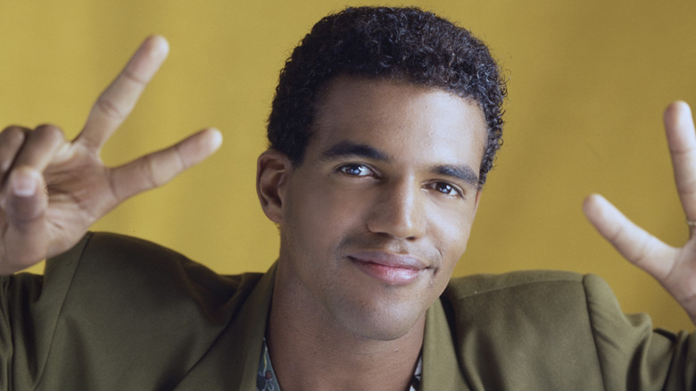 Kristoff St. John flashing peace signs