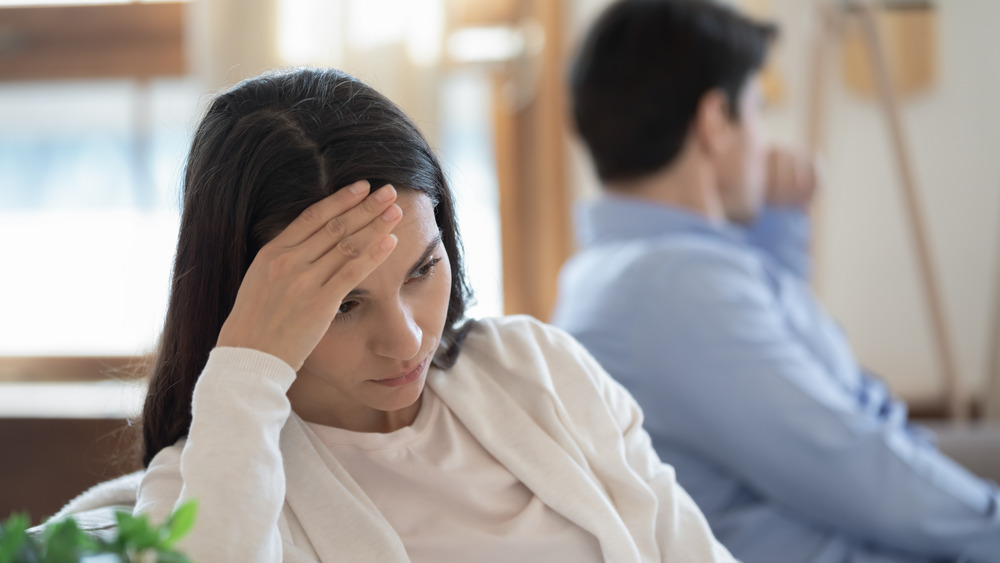 Unhappy couple facing away from each other