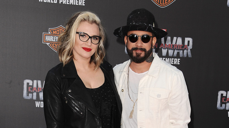 AJ and Rochelle McLean with close mouthed smiles taking a picture together at premiere of "Captain America: Civil War"