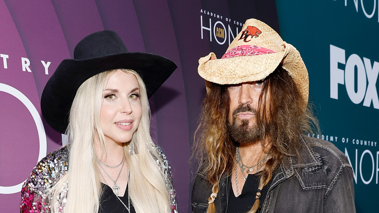 Billy Ray Cyrus and Firerose  pose for a picture at the 16th Annual Academy of Country Music Honors