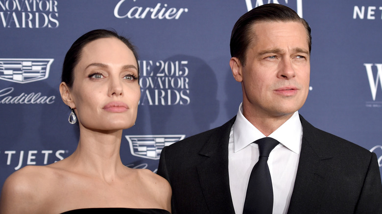 Angelina Jolie and Brad Pitt posing for photos