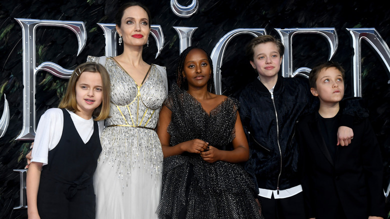 Angelina Jolie posing for photos with her kids