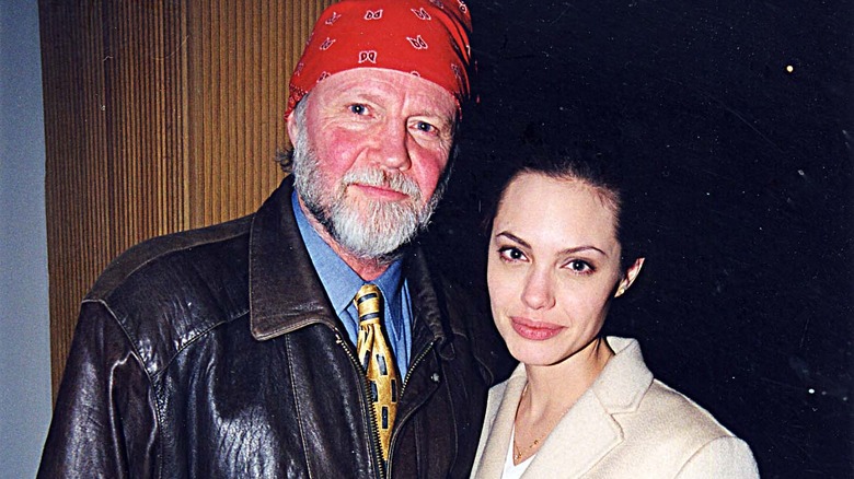 Angelina Jolie posing with Jon Voight