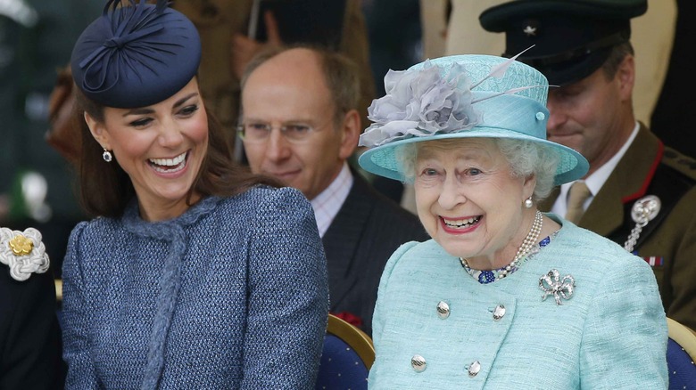 Kate Middleton laughing with Queen Elizabeth