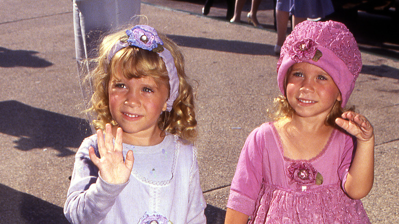 young Olsen twins waving