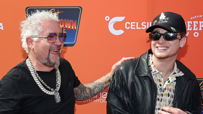 Guy Fieri smiling with his nephew Jules