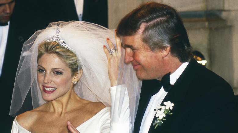 Donald Trump and his new wife Marla Maples pose at their wedding