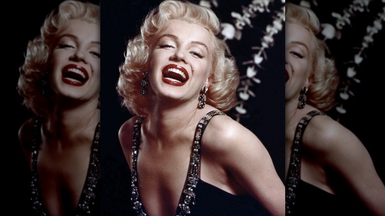 Marilyn Monroe with a big smile, posing for a photo