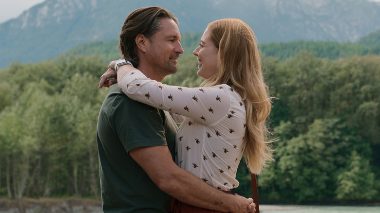 Alexandra Breckenridge and Martin Henderson hugging.