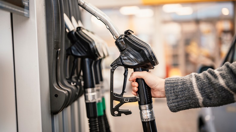 woman pumping gas