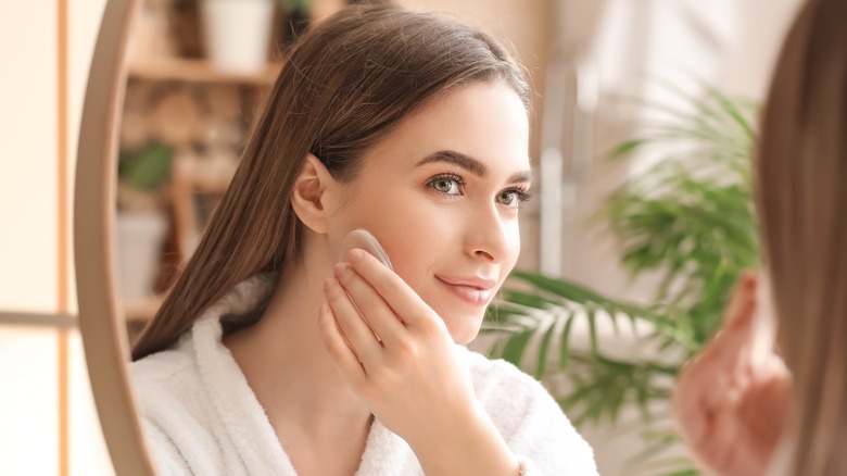 Woman applying foundation