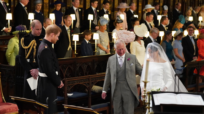 Then-Prince Charles escorts Meghan down aisle to Prince Harry