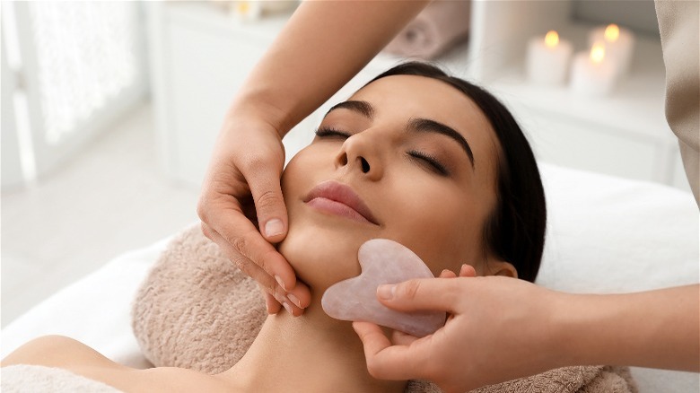 Woman gets a gua sha massage