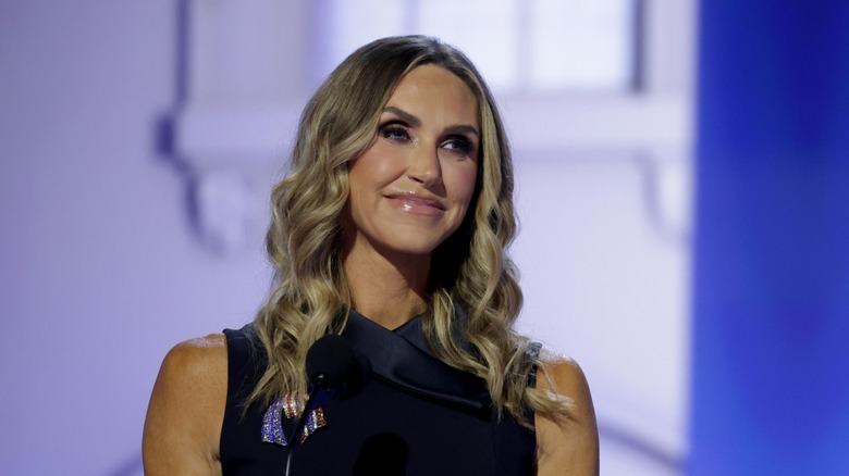 Lara Trump smiling at a podium