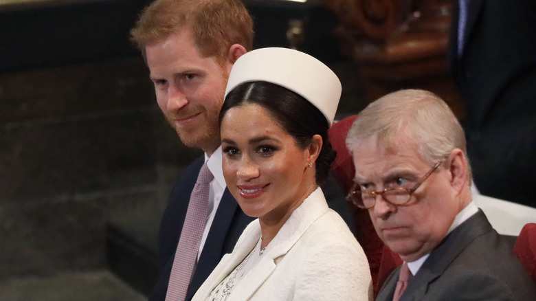 Prince Harry, Meghan Markle, and Prince Andrew sitting together