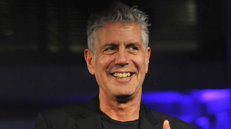 Anthony Bourdain smiling in black