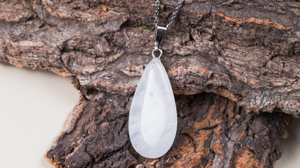 Selenium crystal necklace on bark 