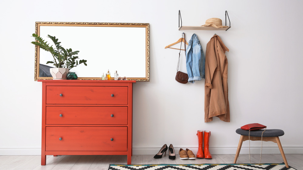 Mirror in hallway with furniture