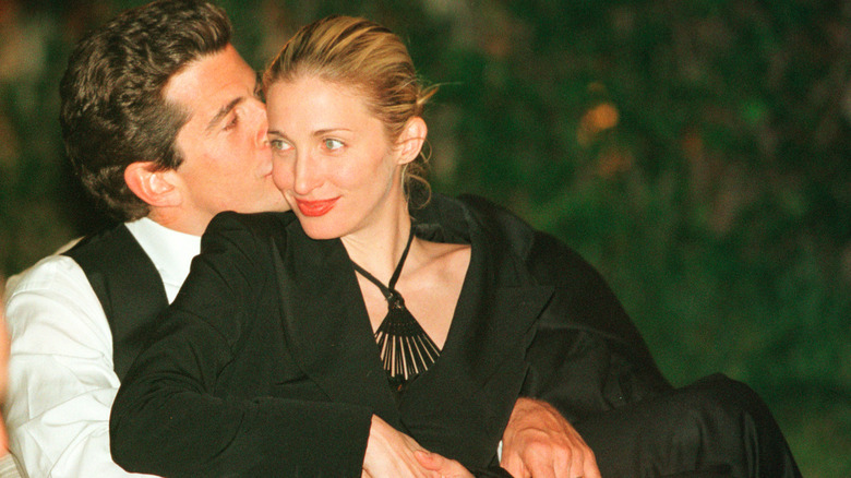 John F. Kennedy Jr. kissing Carolyn Bessette