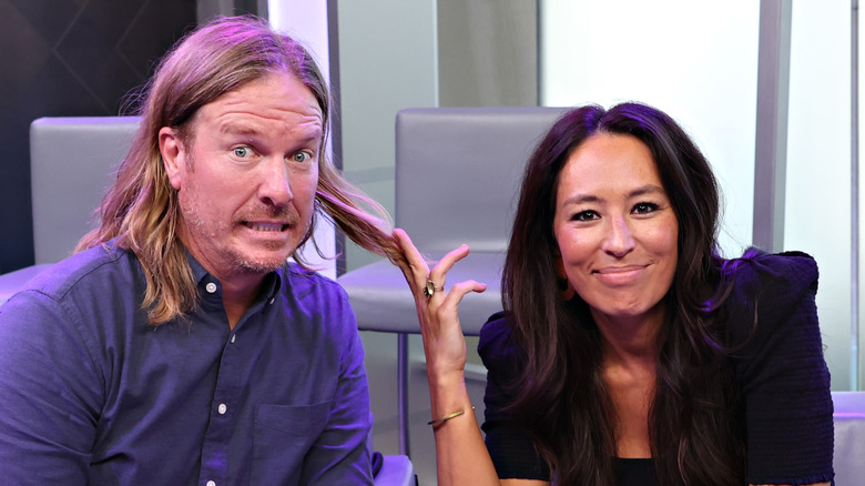 Chip and Joanna Gaines goof around on a sofa