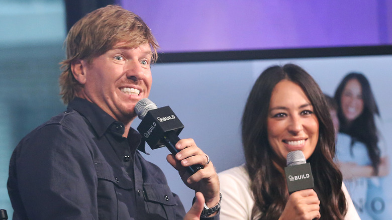 Chip and Joanna Gaines speaking onstage 