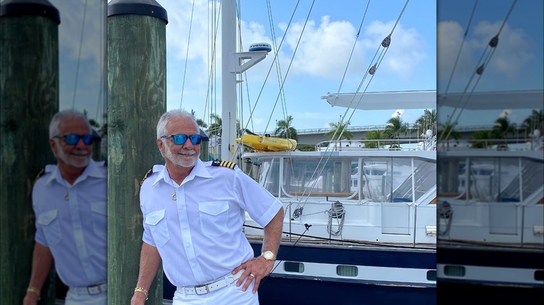 Captain Lee posing by boat