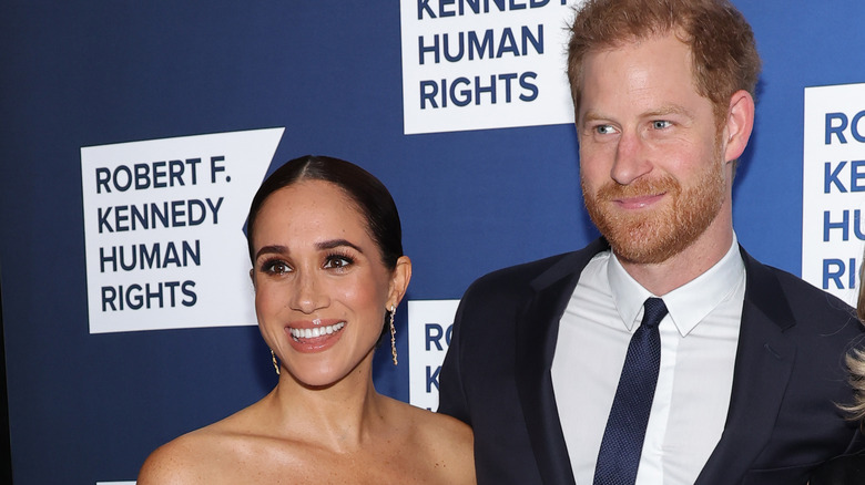 Prince Harry and Meghan Markle smiling