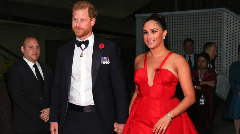 Harry and Meghan in formal attire at event