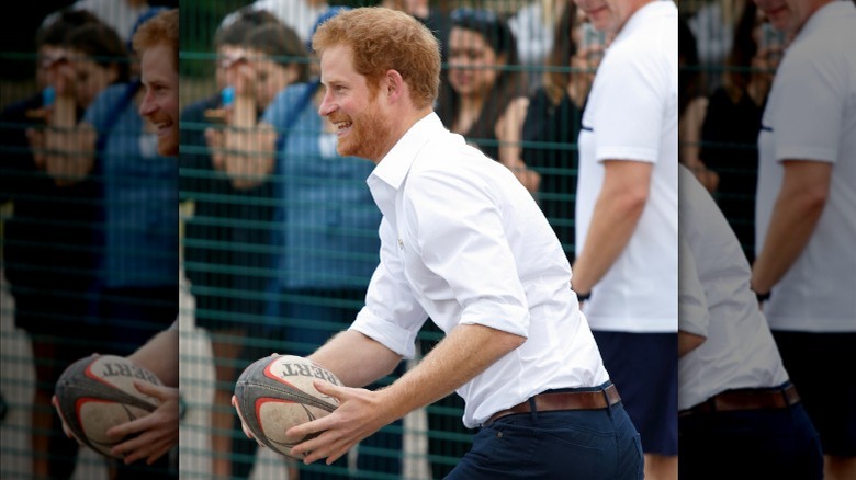 Prince Harry playing rugby