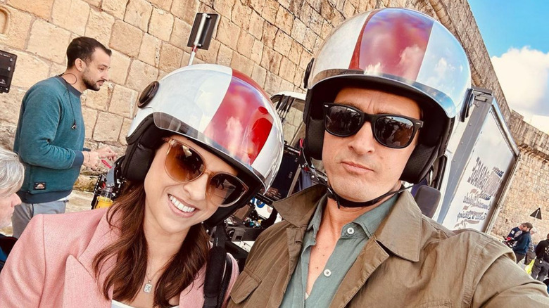 Lacey Chabert and Will Kemp posing in helmets and glasses