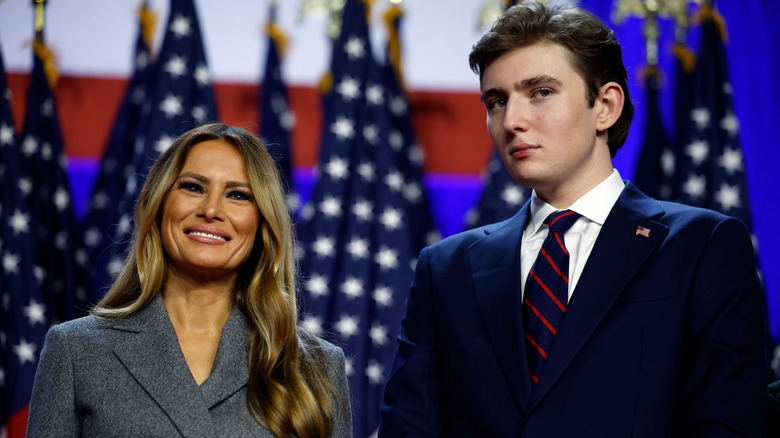 Melania Trump smiling while Barron Trump looks stoic