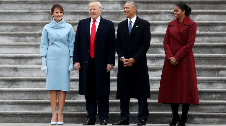 The Trumps and the Obamas similing